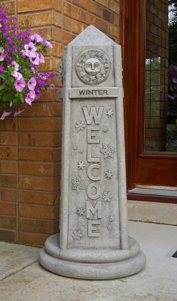 Four-Sided Welcome Obelisk with Seasons Winter sun blowing snow